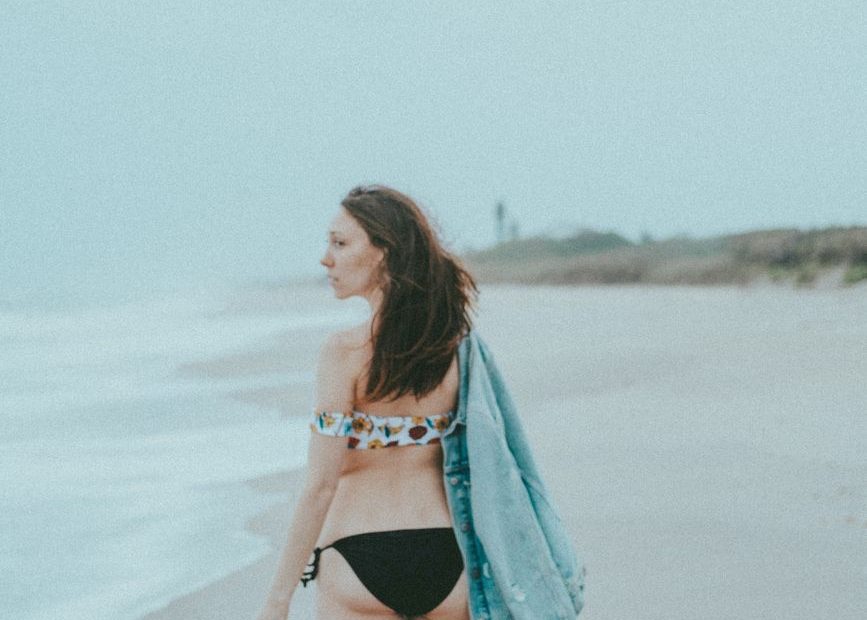 Woman in a bikini by the water