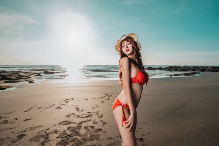 Woman in a bikini by the water